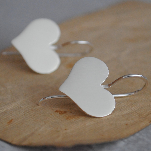 Sterling heart earrings in a cute whimsical shape The ear wires are soldered dir