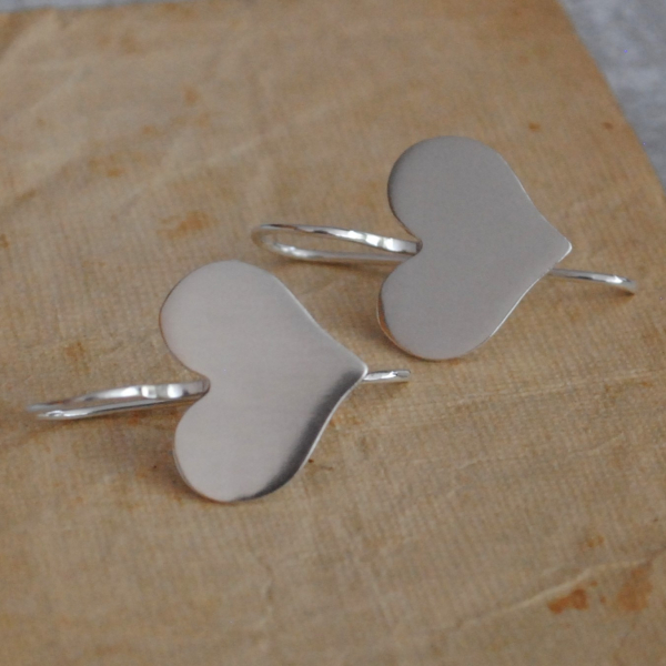 Sterling heart earrings in a cute whimsical shape The ear wires are soldered dir