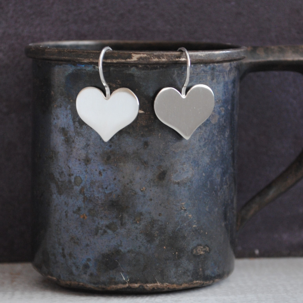 Sterling heart earrings in a cute whimsical shape The ear wires are soldered dir